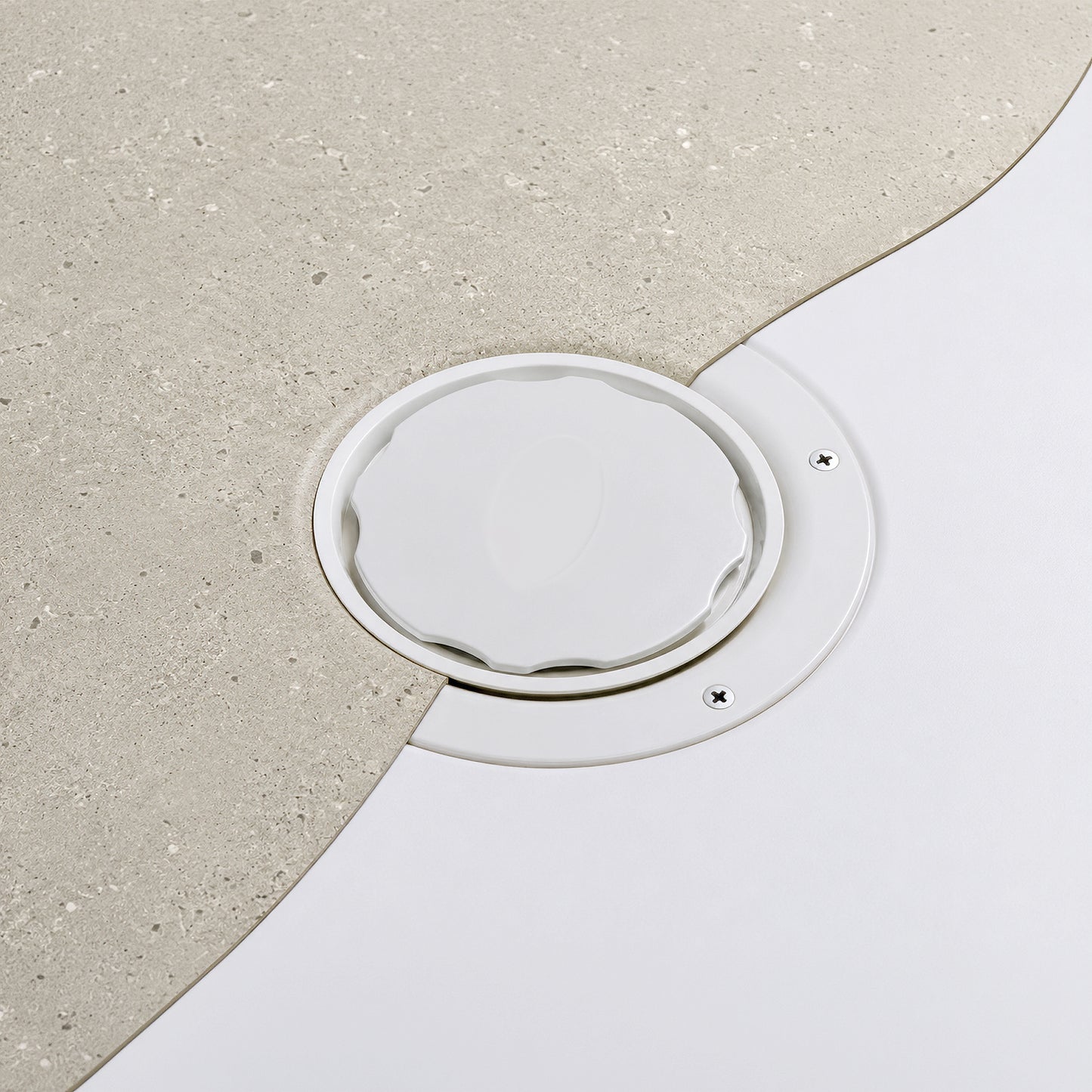 Close up of Tuffdeck shower tray waste installed with Vinyl Flooring