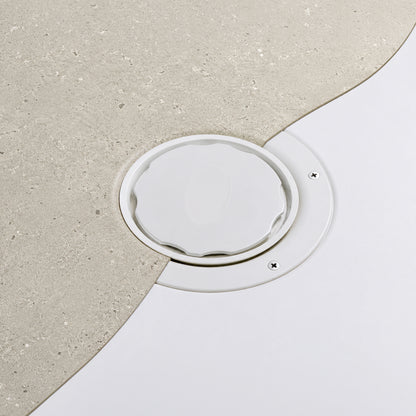 Close up of Tuffdeck shower tray waste installed with Vinyl Flooring